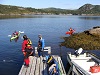 Kayaks on floating dock and in water